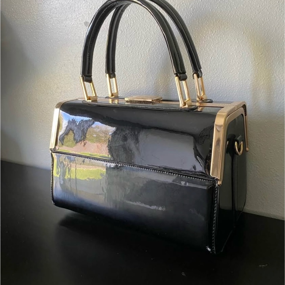 Elegant Black Handbag with Gold Accents